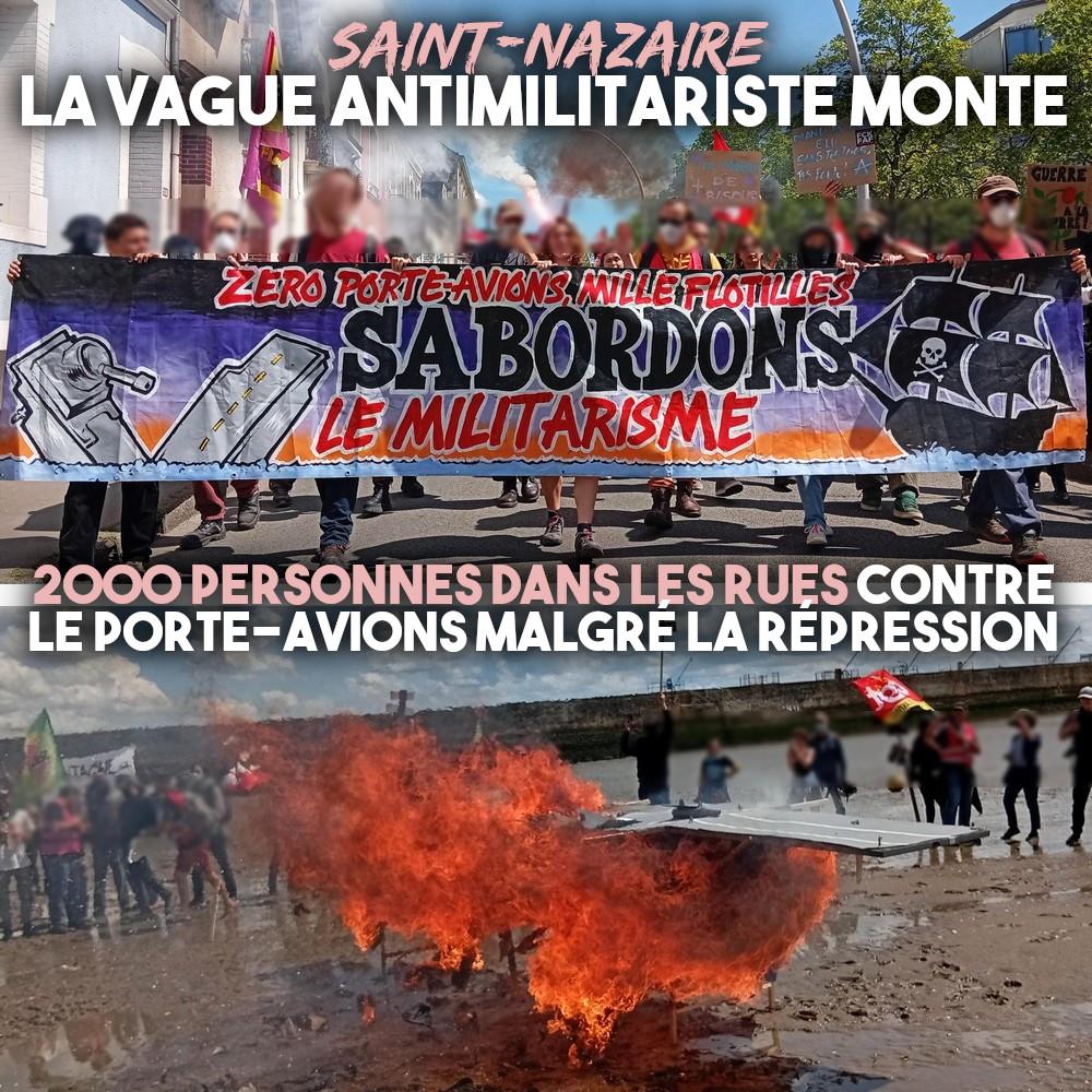 À Saint-Nazaire ce 8 mai, une banderole "sabordons le militarisme" et une maquette de porte-avions en flammes